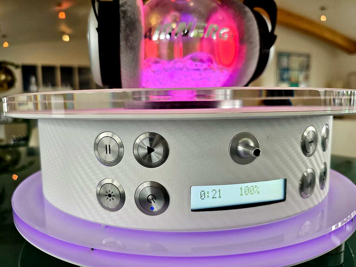 Magenta colored light illuminates appliance and water bubbler